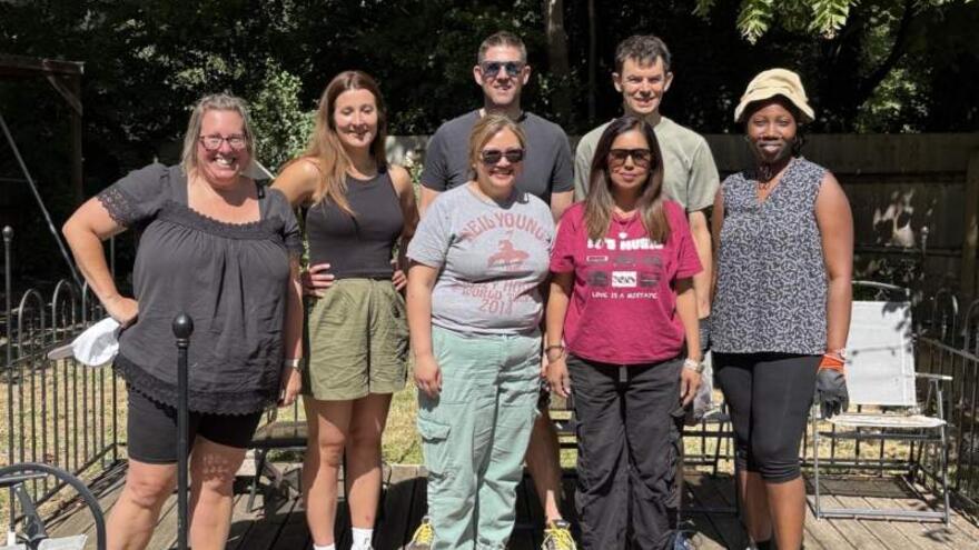 Mencap finance team picture while volunteering in a garden