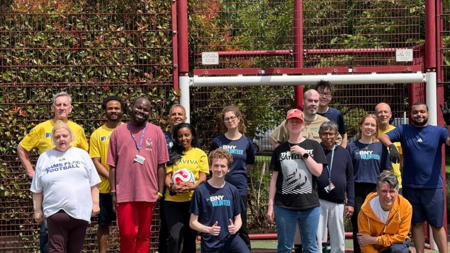 A crowd of people on a football pitch