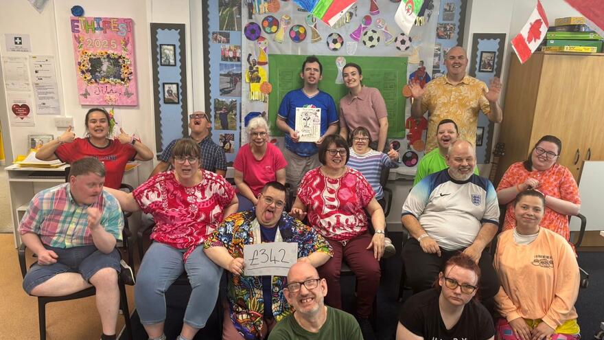 Residents at Ethicare with one person holding up a paper saying £342