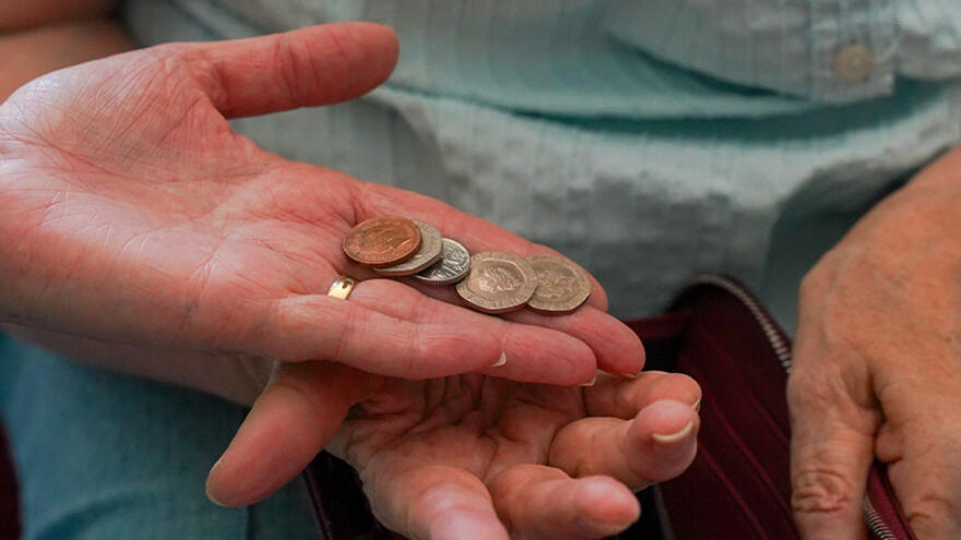 Hands holding coins