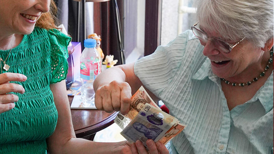 Two women counting money