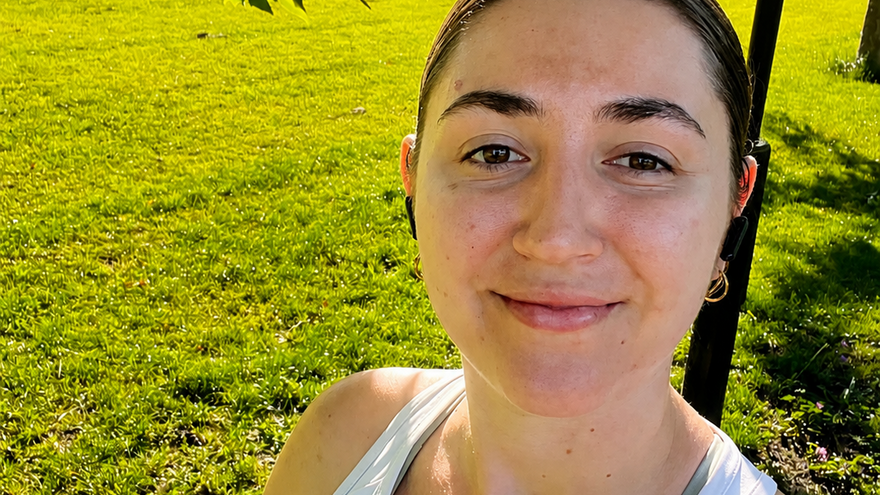 Rowan wearing a white running top looking at camera