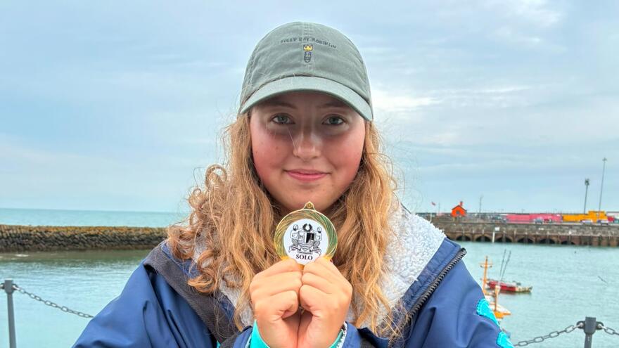Girl holding medal 