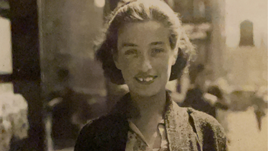 Judy Fryd stood outside on a street.