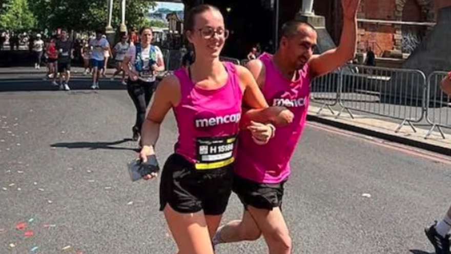 two mencap runners on the streets of London
