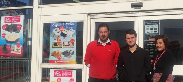 Three people stood outside Poundstretcher shop.