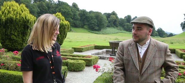 Man and woman stood in National Trust gardens.