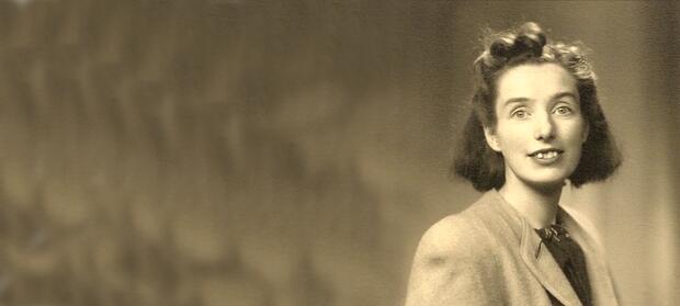 Old sepia image of woman, Judy Fryd, sat posing for the camera