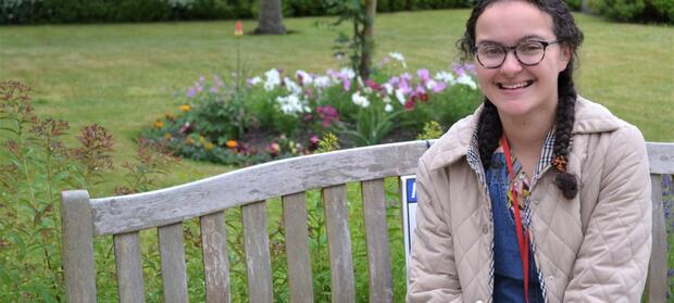 Girl sits on bench