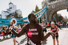 A man running under Tower Bridge in the London marathon