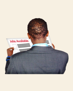 A man reading the job adverts in a newspaper