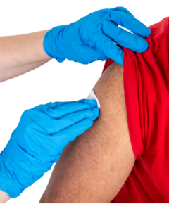 A pair of hands in blue rubber gloves swabbing clean a persons arm in preparation of an injection