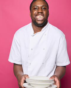 Aaron holding some plates