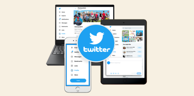 Twitter logo in front of an ipad, mobile phone and laptop