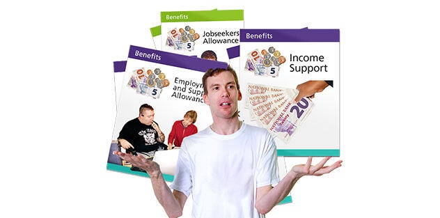 A man standing in front of leaflets about different benefits